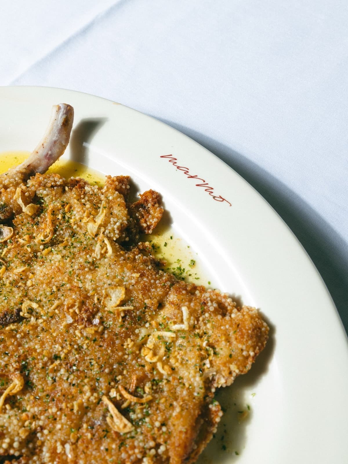 Golden pork Milanese served at Marmo