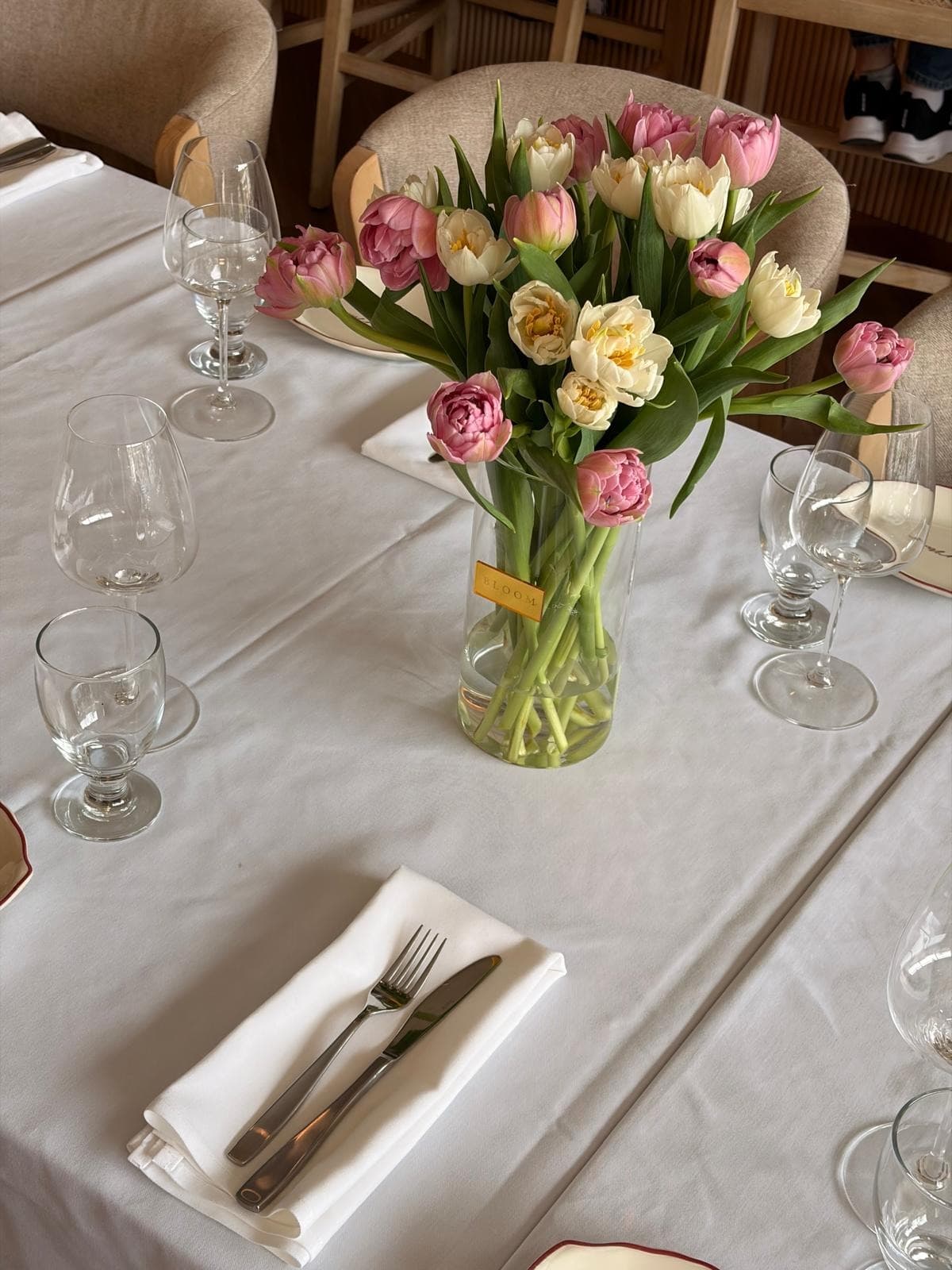 A Marmo table dressed for a private celebration with tulips